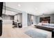Finished basement showcasing a modern living area, office space, and stylish sliding barn door at 11821 Joplin Ct, Commerce City, CO 80022