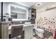 Updated bathroom featuring a modern vanity, vessel sink, and chic floral shower curtain at 11821 Joplin Ct, Commerce City, CO 80022
