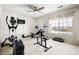 Bright home gym with cardio and weight equipment at 11821 Joplin Ct, Commerce City, CO 80022