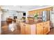 Open-concept kitchen view with hardwood floors, granite countertops, and stainless steel appliances at 11821 Joplin Ct, Commerce City, CO 80022