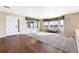 Bright living room with hardwood floors and large windows for ample natural light at 11821 Joplin Ct, Commerce City, CO 80022