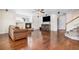 Living room with hardwood floors, a fireplace, and a comfortable seating area at 11821 Joplin Ct, Commerce City, CO 80022