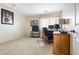 Home office with a window, desk, neutral carpet, and light-colored walls at 11821 Joplin Ct, Commerce City, CO 80022