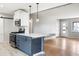 Stylish kitchen overlooking living area with stainless steel appliances and a breakfast bar at 5141 S Grant St, Littleton, CO 80121