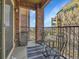 Outdoor balcony featuring iron furniture, with a great view of the neighborhood at 1044 Rockhurst Dr # 202, Highlands Ranch, CO 80129