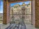 Covered balcony with beautiful brick pillars offering community views at 1044 Rockhurst Dr # 202, Highlands Ranch, CO 80129