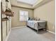 Bright bedroom with neutral walls and a window with white shutters at 1044 Rockhurst Dr # 202, Highlands Ranch, CO 80129