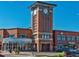 Commercial real estate featuring a clock tower near restaurants and stores like Jimmy John's and Floyd's Barbershop at 1044 Rockhurst Dr # 202, Highlands Ranch, CO 80129