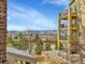 Balconies offer great views of the front landscape and the mountains in the distance at 1044 Rockhurst Dr # 202, Highlands Ranch, CO 80129