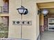 Eye-catching house numbers and decorative wall lights highlight the front entrance at 1044 Rockhurst Dr # 202, Highlands Ranch, CO 80129