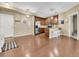 Inviting living room open to a kitchen with hardwood floors and lots of light at 1044 Rockhurst Dr # 202, Highlands Ranch, CO 80129