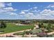 Scenic view of the expansive green space and walking paths within Civic Green Park with a picnic pavilion at 1044 Rockhurst Dr # 202, Highlands Ranch, CO 80129