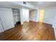 Finished basement showcasing bright white walls, hardwood floors, and a spacious closet at 4753 S Gar Way, Littleton, CO 80123
