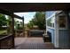 Wooden deck featuring a hot tub and seating with access to the backyard at 4753 S Gar Way, Littleton, CO 80123
