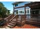 Wooden deck offering multi-level seating areas perfect for entertaining guests outdoors at 4753 S Gar Way, Littleton, CO 80123