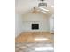 Bright living room with vaulted ceilings, skylights, a ceiling fan, and a cozy fireplace at 4753 S Gar Way, Littleton, CO 80123