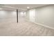 Finished basement featuring neutral colored carpet, recessed lighting, and a support column at 6556 Wolff St, Arvada, CO 80003