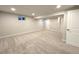 Finished basement featuring neutral colored carpet, recessed lighting, and an egress window at 6556 Wolff St, Arvada, CO 80003