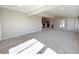 Spacious living room with carpet, recessed lighting, and an open floor plan at 6556 Wolff St, Arvada, CO 80003