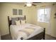 Cozy bedroom with a wooden bed frame, neutral decor and natural light at 7603 Sabino Ln, Castle Rock, CO 80108