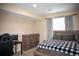Finished basement bedroom with a large window, dresser, and desk at 7603 Sabino Ln, Castle Rock, CO 80108