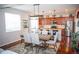 Dining area of kitchen featuring a large island and stainless steel appliances at 7603 Sabino Ln, Castle Rock, CO 80108