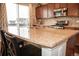 Kitchen island featuring granite countertops and stainless steel appliances at 7603 Sabino Ln, Castle Rock, CO 80108