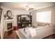 Spacious living room with a fireplace and large windows providing natural light at 7603 Sabino Ln, Castle Rock, CO 80108