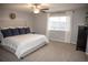 Serene bedroom with a large window, ceiling fan, and plush bedding at 7603 Sabino Ln, Castle Rock, CO 80108