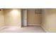 Neutral basement with large open space and light carpet at 2034 S Lincoln St, Denver, CO 80210