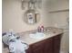 Vanity with a light countertop and dark wood cabinets at 2034 S Lincoln St, Denver, CO 80210