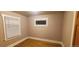 Bright bedroom featuring hardwood floors, window with blinds and natural light at 2034 S Lincoln St, Denver, CO 80210