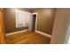 Cozy bedroom with hardwood floors, a window for natural light, and neutral walls at 2034 S Lincoln St, Denver, CO 80210