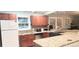 Bright kitchen with granite countertops, stainless steel appliances, and ample cabinet space at 2034 S Lincoln St, Denver, CO 80210