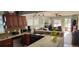 Bright kitchen open to living space with granite counters and modern appliances at 2034 S Lincoln St, Denver, CO 80210