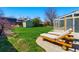 This backyard features a lush lawn, a convenient storage shed, and a charming patio with lounge chairs at 4581 S Garrison St, Littleton, CO 80123