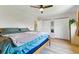 This spacious bedroom features wood floors, closets and calm colors create a relaxing atmosphere for comfort and style at 4581 S Garrison St, Littleton, CO 80123