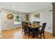 Bright dining room features hardwood floors, wooden furniture set, and natural light at 4581 S Garrison St, Littleton, CO 80123
