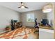 Comfortable home office space bathed in natural light featuring hardwood floors and a modern desk setup for productivity at 4581 S Garrison St, Littleton, CO 80123