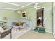 Bright sunroom featuring a dining area, ample seating, and seamless access to the outdoors for relaxation and entertainment at 4581 S Garrison St, Littleton, CO 80123