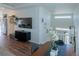 Open-concept living area with modern furniture, a large TV, and decor, creating a stylish and inviting space at 16382 E 111Th Dr, Commerce City, CO 80022