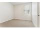 Neutral bedroom with carpet, a window with blinds, and white walls at 42982 Colonial Trl, Elizabeth, CO 80107