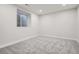 Unfinished basement space with natural light and neutral-colored carpet provides endless options at 4 Meadowlark Ln, Littleton, CO 80123