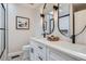 Modern bathroom featuring double vanity, elegant fixtures, and stylish design at 4 Meadowlark Ln, Littleton, CO 80123