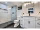 Stylish bathroom features a glass-enclosed shower, sleek vanity, and modern black hardware at 4 Meadowlark Ln, Littleton, CO 80123