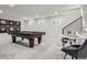 Spacious game room featuring a billiard table, additional seating area, and plenty of room for entertainment at 4 Meadowlark Ln, Littleton, CO 80123