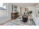 Cozy living room features modern décor, a work space, and ample natural light from the window at 4 Meadowlark Ln, Littleton, CO 80123