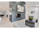 Spacious living area with vaulted ceilings, a modern fireplace, and seamless flow into other living spaces at 4 Meadowlark Ln, Littleton, CO 80123