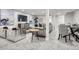 Open-concept living area boasts modern furniture, stylish decor, and bright recessed lighting at 4 Meadowlark Ln, Littleton, CO 80123