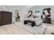 Spacious main bedroom with French doors, wood floors, and great natural light at 4 Meadowlark Ln, Littleton, CO 80123